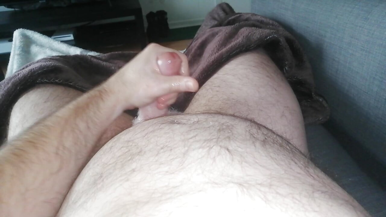 Chubby daddy jerking off his cock watching porn