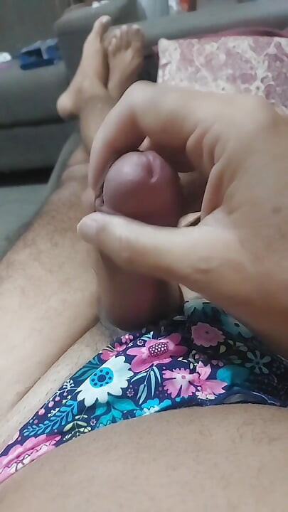 Ladysilva in bikini on the couch jerking off his cock showing off her hot ass