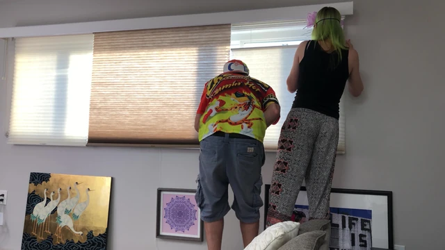 Couple Peeping Outside Apartment Window