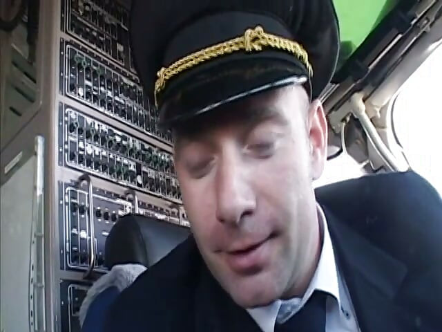 Randy pilot fondles sexy brunette in the cockpit