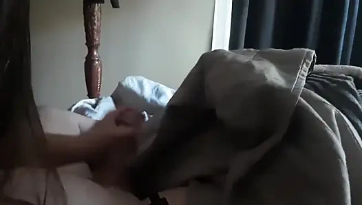 Handjob While Playing in Bed