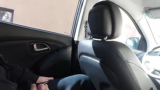 Elegant stepmom in stockings teases her stepson in the car, in public, and rubs his cock with her feet