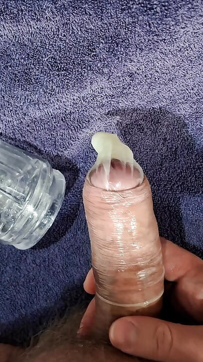 Guy using see through masturbator