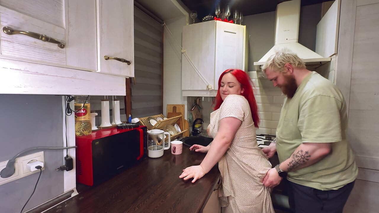 Sex in the kitchen with a red-haired wife. .