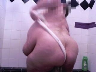 Fat guy taking a shower