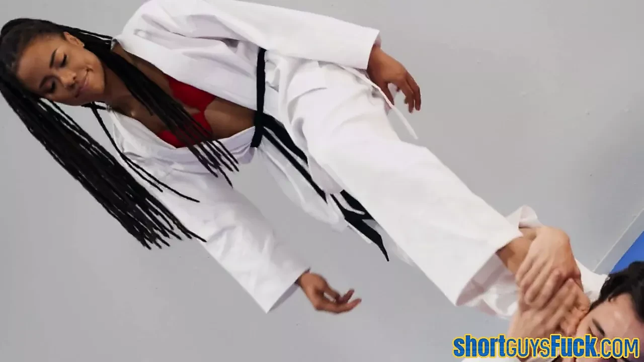 Ebony rides short guy&rsquo;s cock during karate class