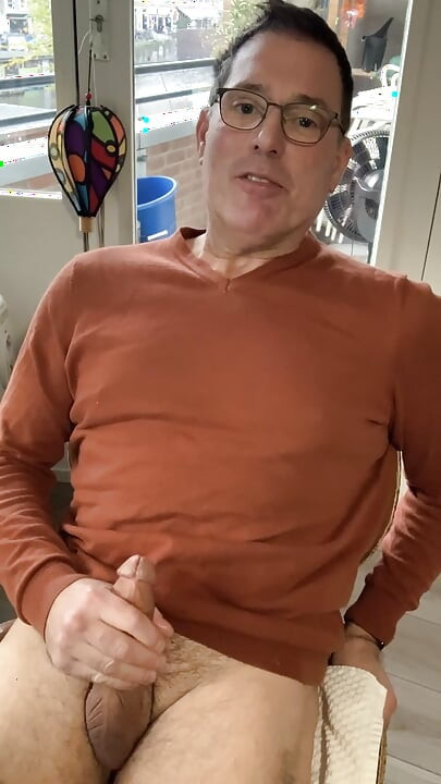 Jerking off and cumming in my orange sweater