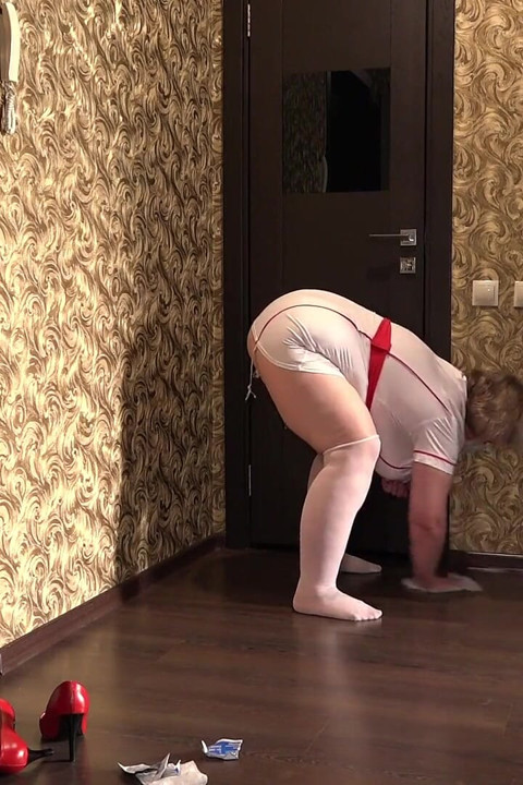 Creampie Under a Mature Nurse's Gown. a Fat MILF in a Medical Uniform Cleans up Behind the Scenes. Cum Flows Out of Her Cunt