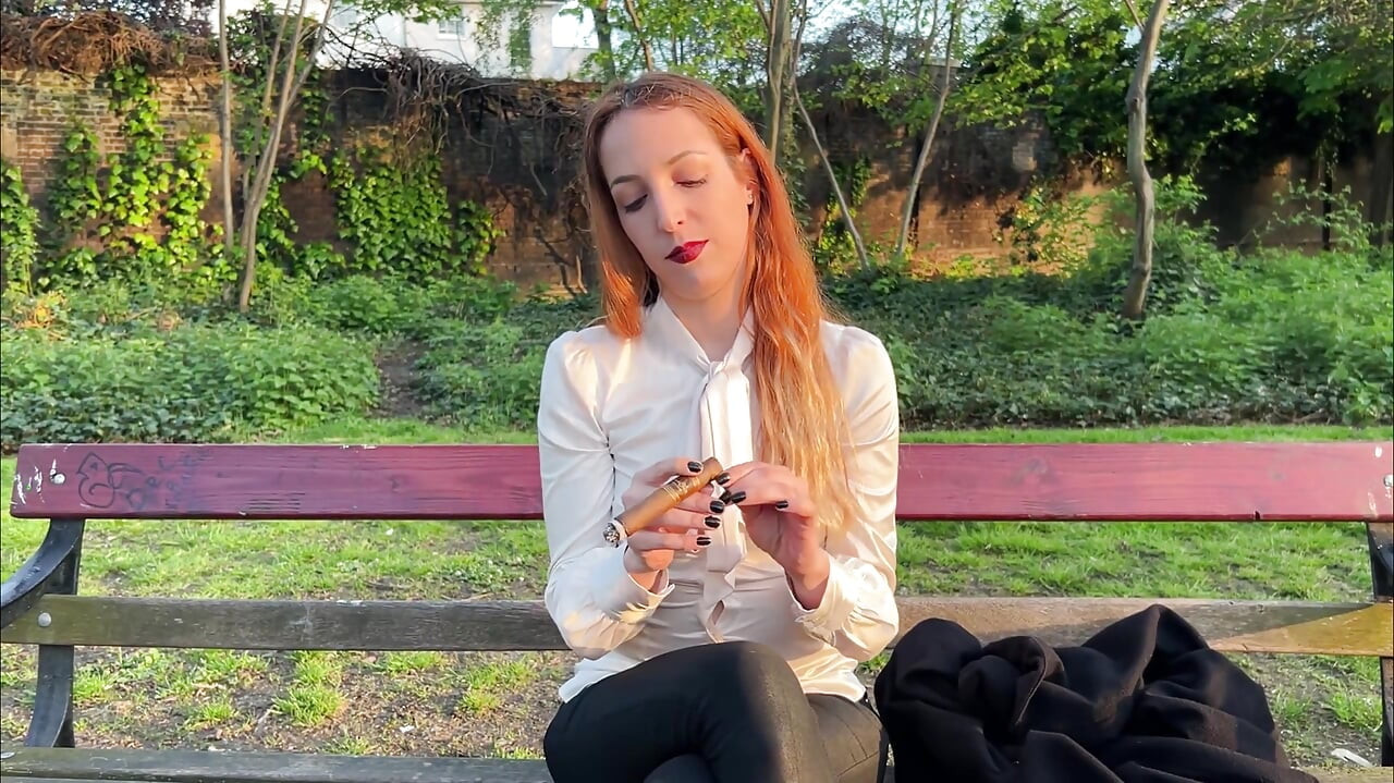 Liz Rainbow Smoking a Flor De Oliva Cigar Outdoors