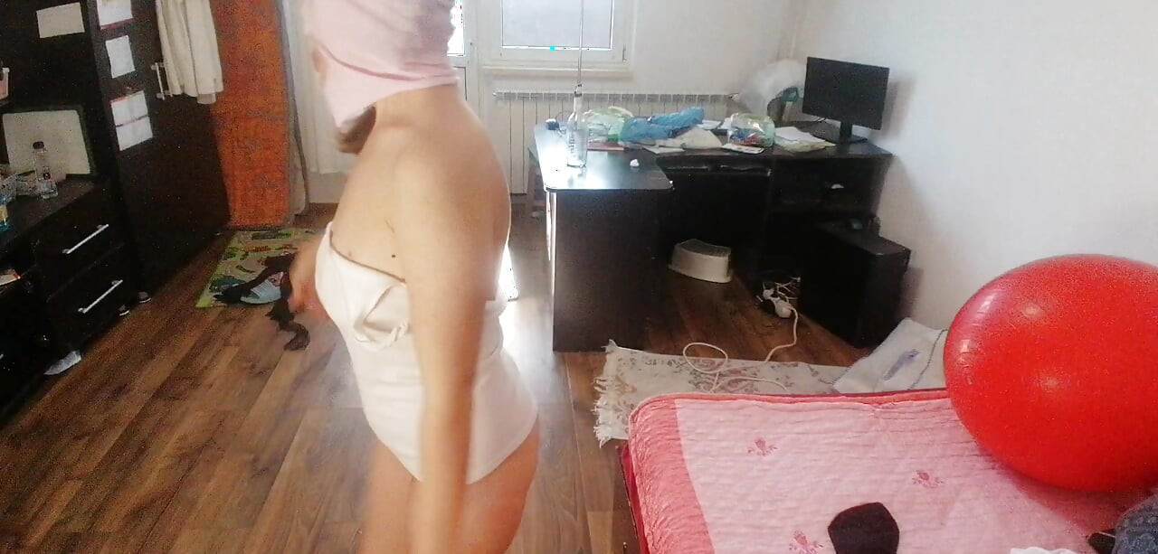 Amateur wife has fun trying on clothes and cutting them.