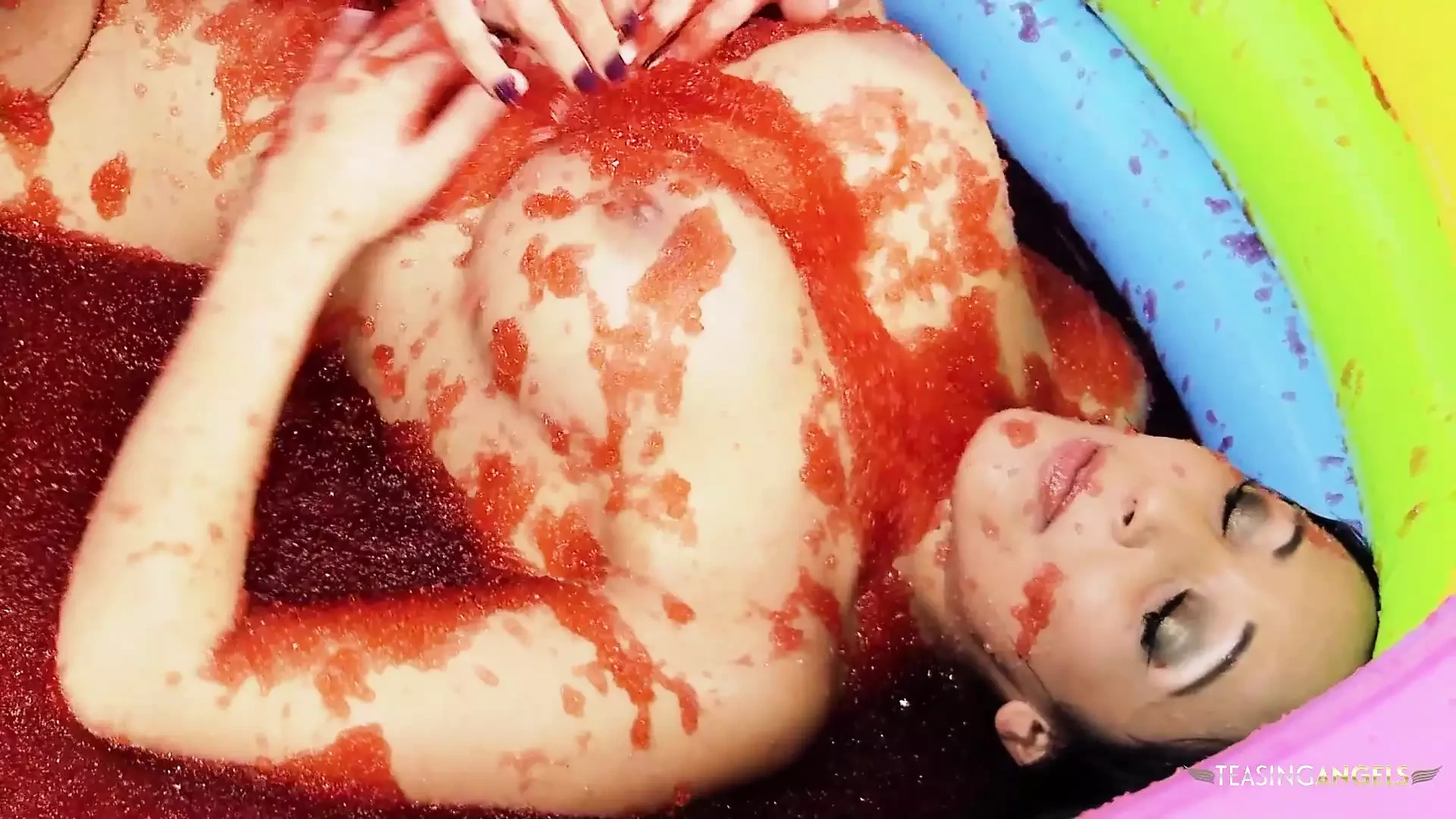 Kissing turns into food wrestling between the two brunette