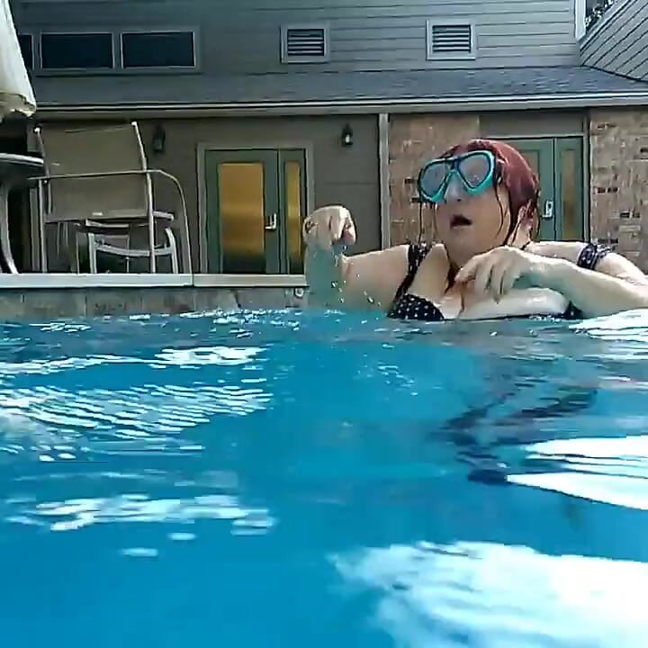 Couple Underwater Diving and Swimming
