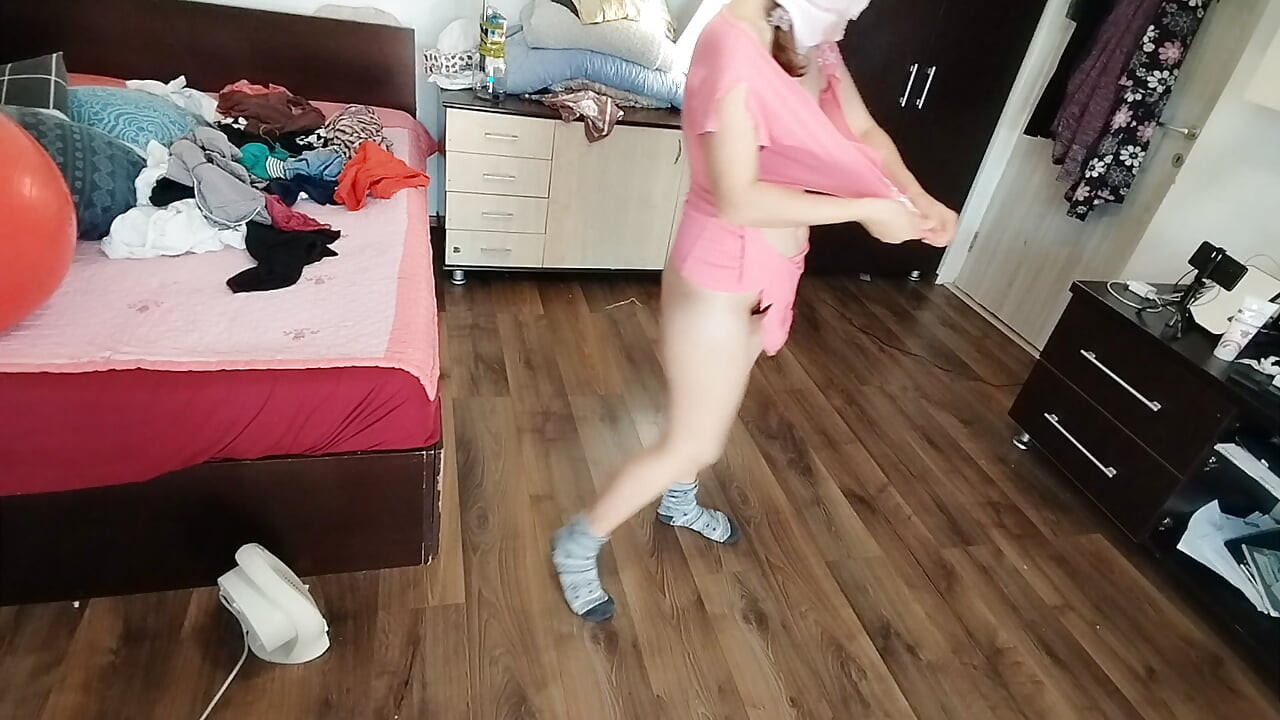 Amateur wife enjoys trying on clothes and cutting them.