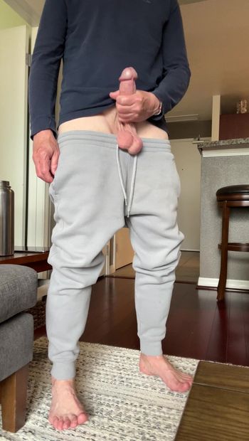 Standing and stroking my hard cock and showing my big bouncing low hanging balls because its hot and its fun. Bonus bare feet for admirers of dudes feet out there. LMK if you like vids like this.