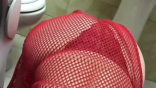Mature redhead gives a good blow job in the bathroom
