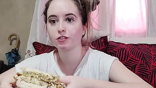 Eating an omelette sandwich with cherry tomatoes