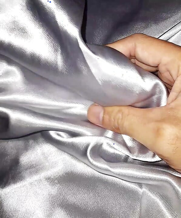Masturbating wearing satin silver long dress in car