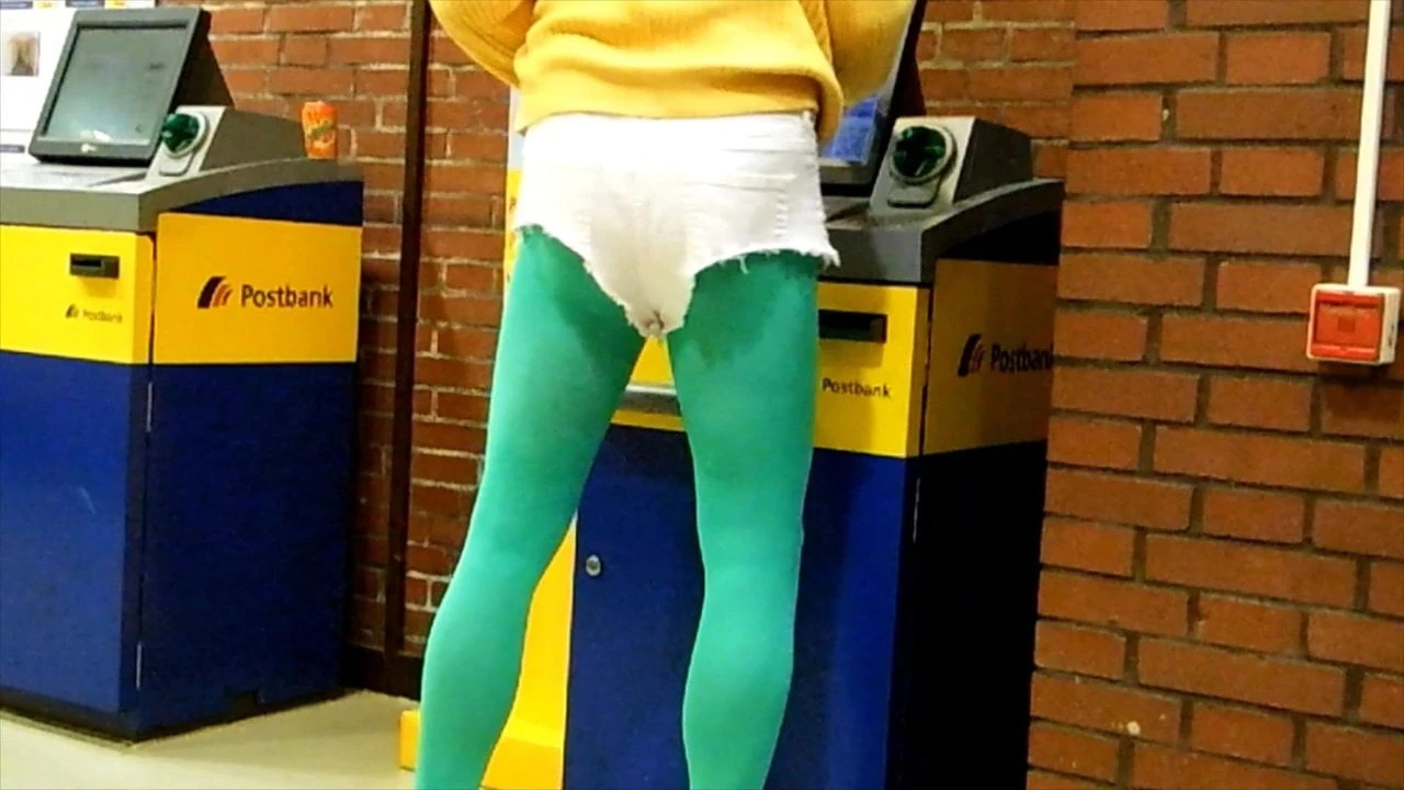 White Hotpants and green pantyhose in public office.
