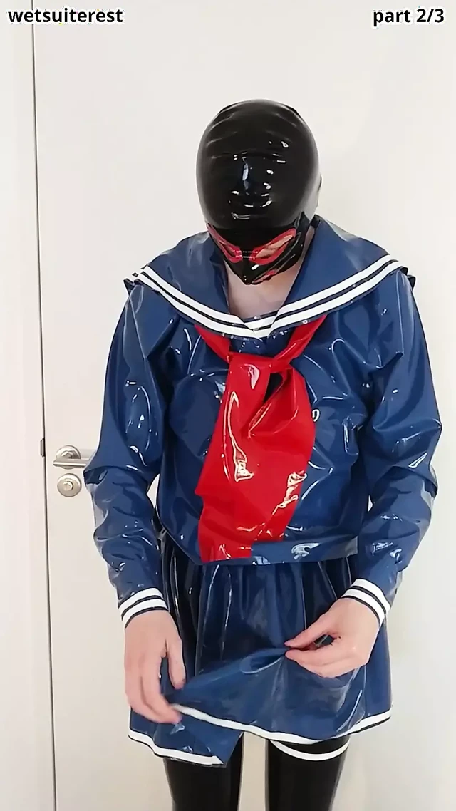 Putting on blue latex Japanese sailor uniform skirt and shirt, rubber maid stockings