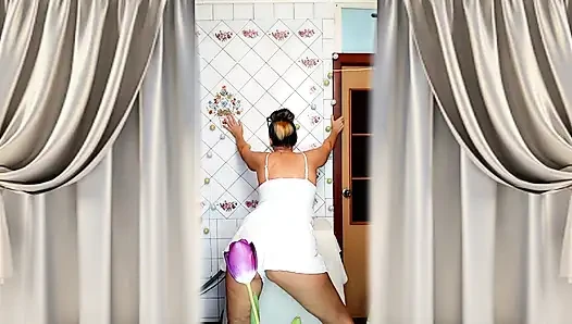 Mature housewife Lukerya twerks her curvy figure in white shorts in the kitchen, hot flirting and teasing movements