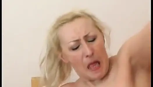 Busty blonde mature is getting drilled on the bed