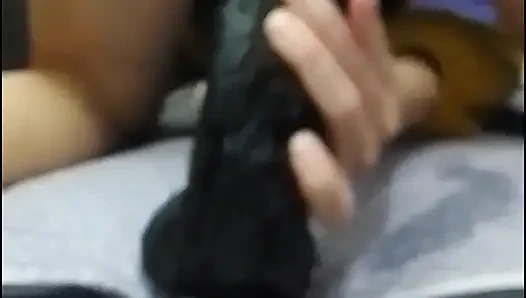 Enjoying thick and long dildo