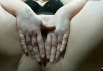 Lady rubs her hairy pussy