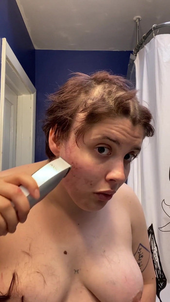 Iconic moment from "Hairless Whore - Adama Daat Amateur Fetish Head and Brow Shave"
