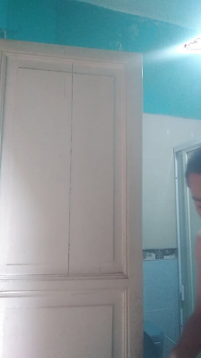 Man washes his face