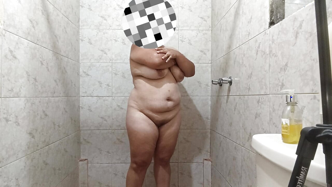 Sexy Latin girl touches herself very rich while showering rich and has giant breasts.