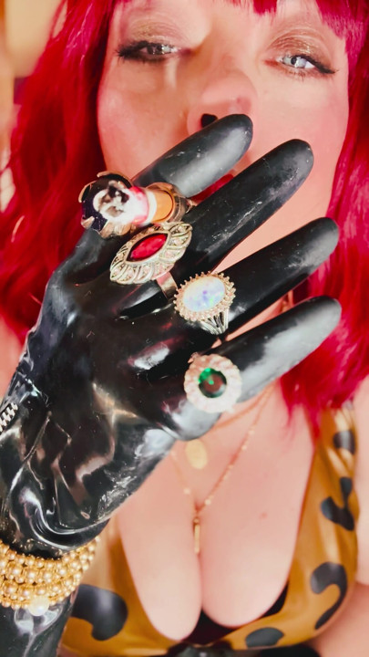 The Beautiful Rubber Beauty Tina Snua Smoking A Cigarette Using A Holder - Smoker Latex Gloves Rings Jewellery | Clip 1