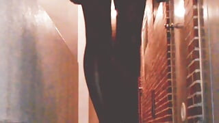 Hot slutty college girl shows her vib remote controller while many people passing by on public street, with vibrator on