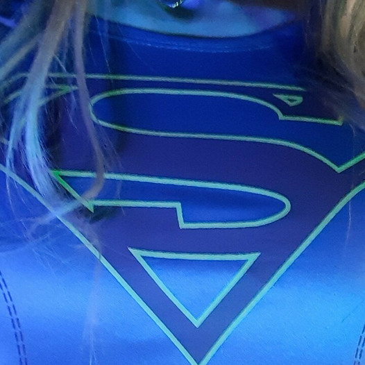 Estebel as Supergirl, stroking and ejaculating.