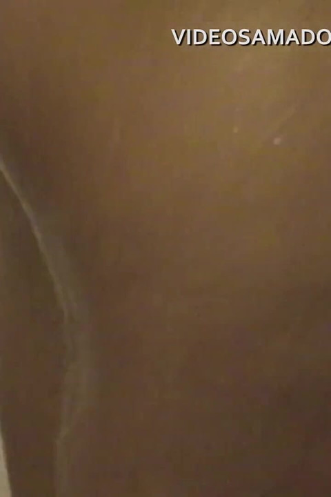 Home video of woman with shaved pussy taking a shower