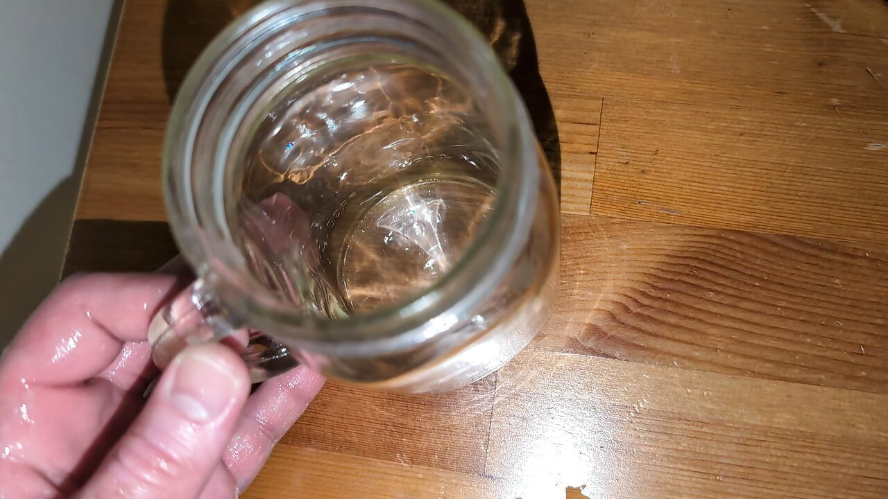 Fat man jerking his hard cock and cumming in a glass