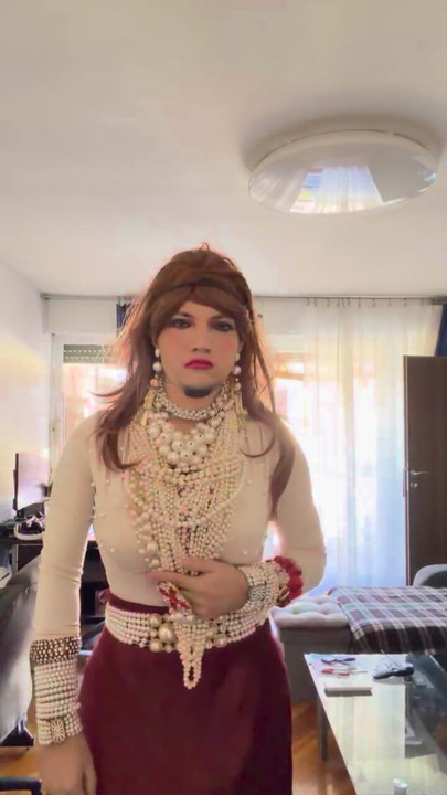 Crossdresser walking around heavily aroused  the apartment in the high heels and lovely pearls and heels.