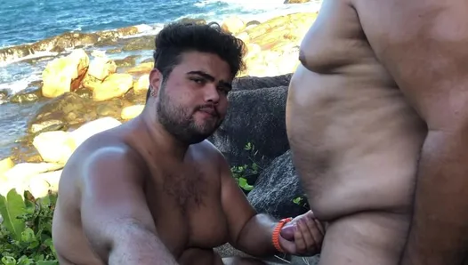 older bear takes his young gay bear to the beach to drink his milk