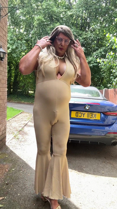 Emotional moment from "Sexy Crossdresser kellycd2022 in gold stretchy catsuit and heels"