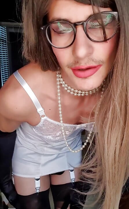 Mistress Jessica dressed up in a vintage white corselette