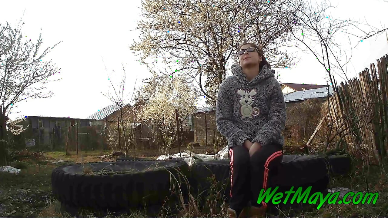 Peeing on some old tires in the yard