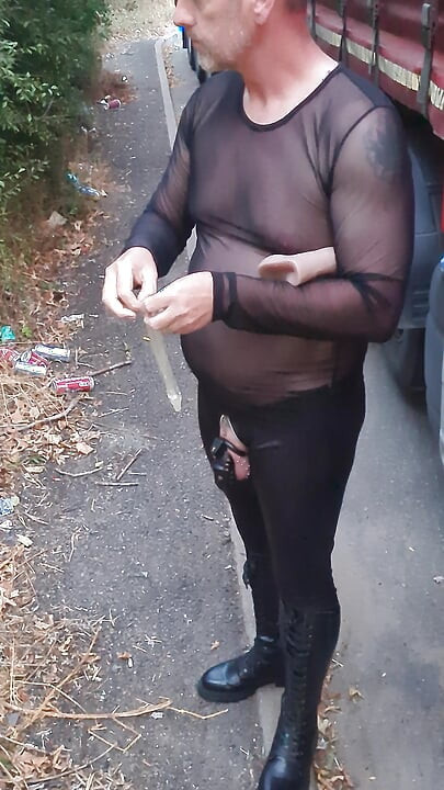 Cock locked sissy sucking dildo outdoors