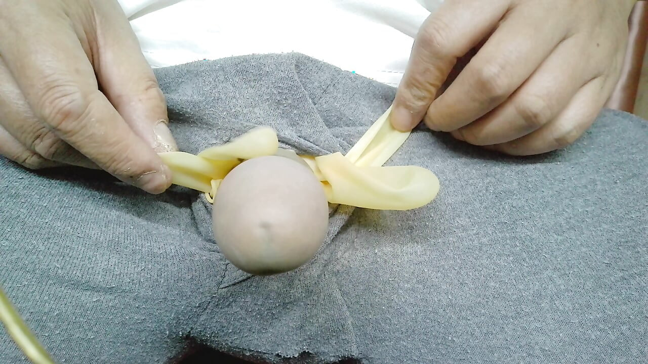 Wearing translucent latex gloves and using a vibrator to achieve multiple orgasms