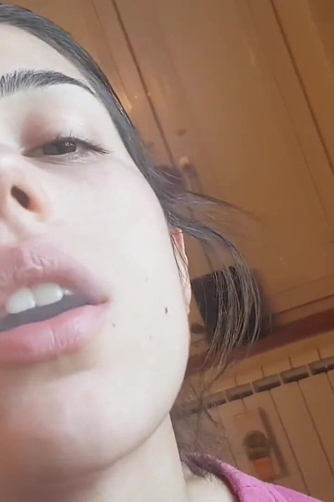 Tempting Italian girl smokes a cigar in a close up video