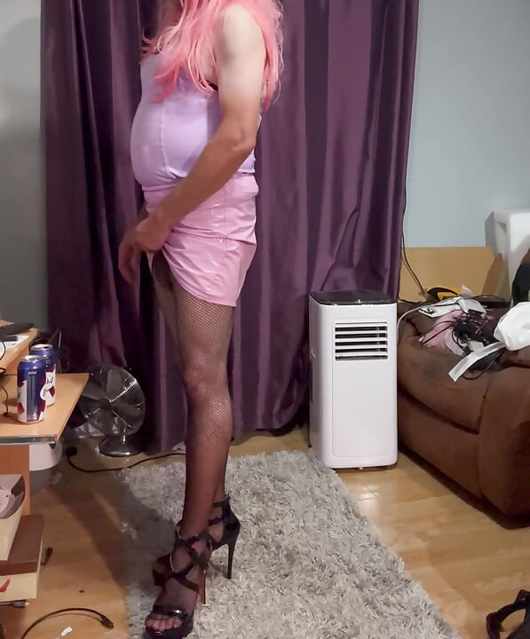 Dressed in pink pvc, fishnets and high heels and edging with lots of cum