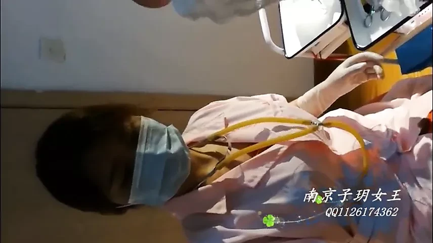 Beautiful Female Surgeon With Surgical Gloves Fisting