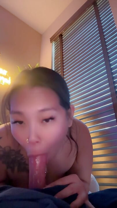 asian mistress gives sloppy dildo blowjob while girlfriend is at work