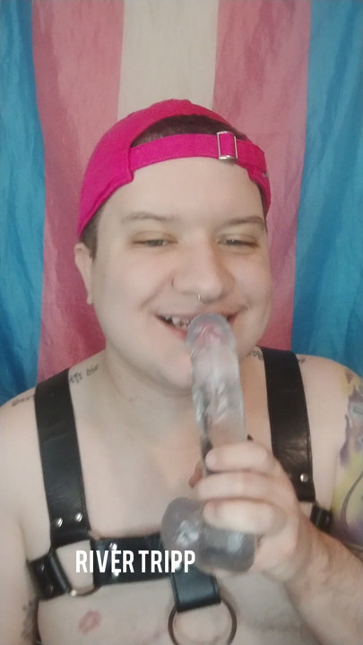 Trans man sucking dildo