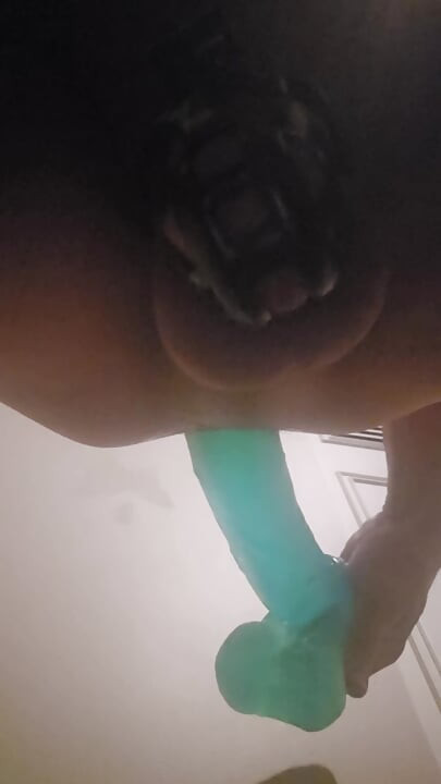 Caged sissy taking huge dildo