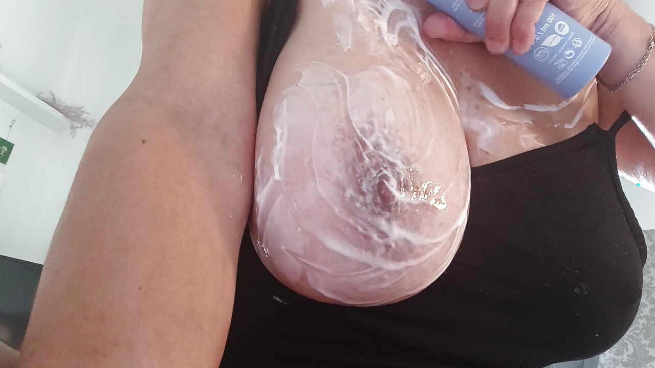 Pampering creamy breasts