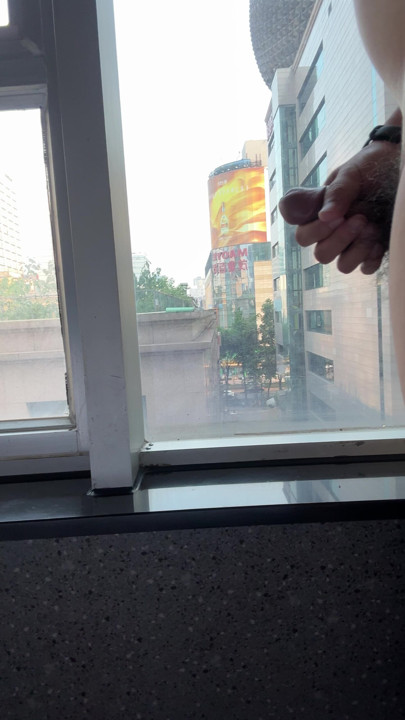 Chinese guy jerking off near the window of the hotel